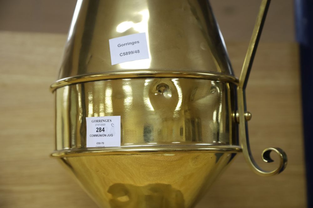 An Aesthetic movement brass communion jug, c.1870, height 49cm